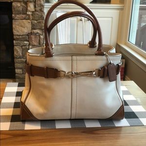 Gently used off white and brown leather Coach bag.
